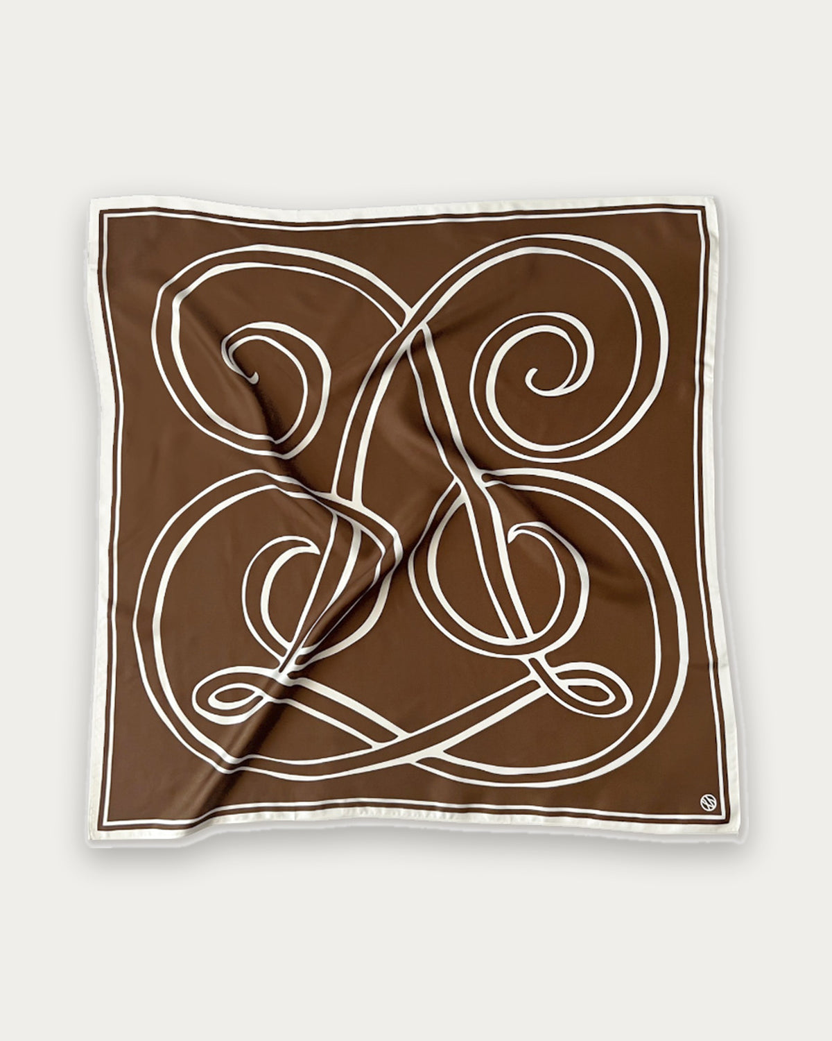 Monogram Scarf in Milk Chocolate by Lescarf, 80x80 cm, laid flat in chocolate brown with a looping cream monogram and cream border