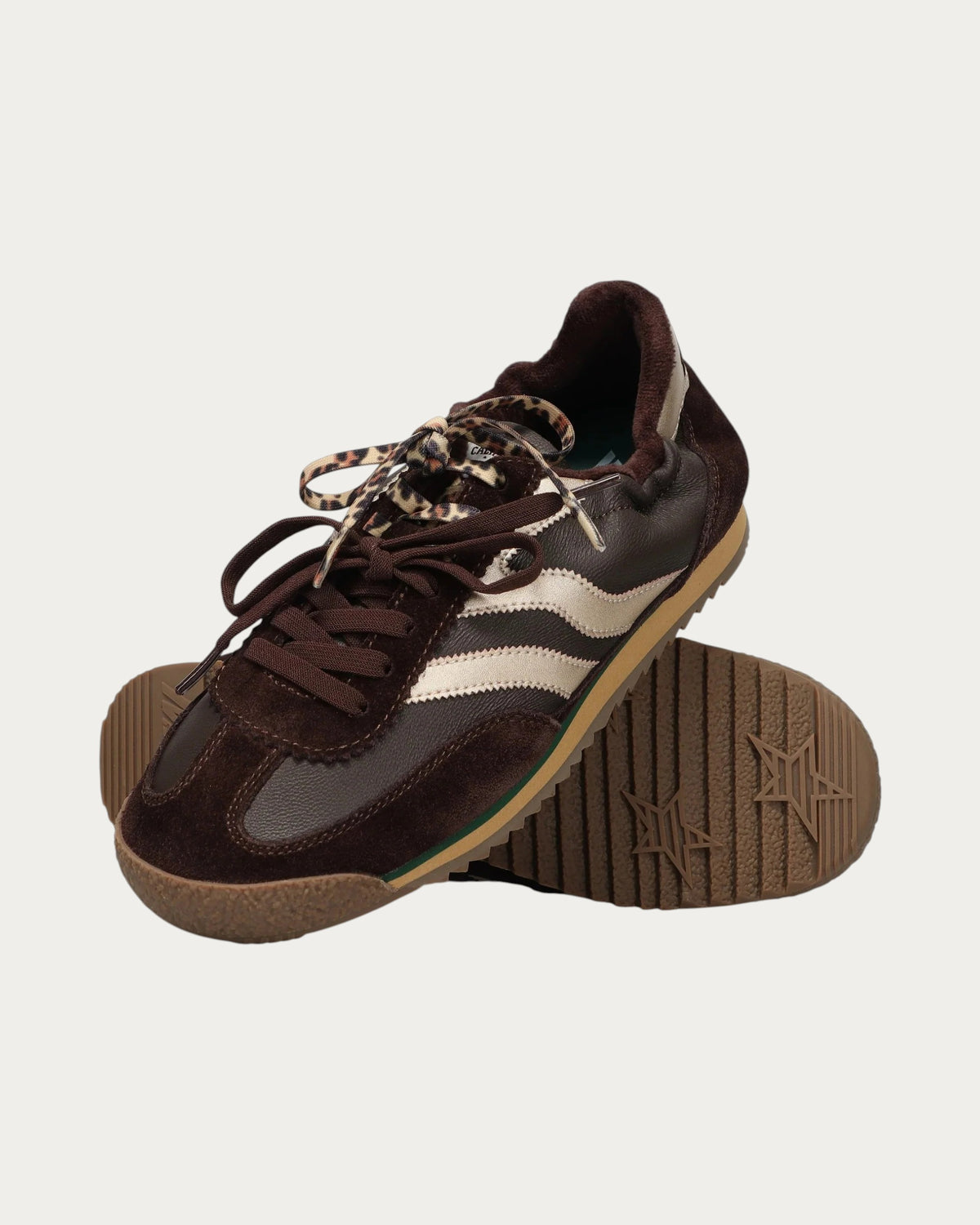 MRP Star Utah Leather Sneaker In Chocolate, one sneaker turned to show the star-patterned sole