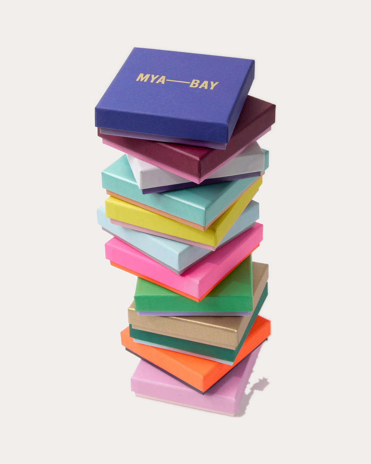 Stack of colourful MYA—BAY gift boxes, each piece arrives in a branded gift box
