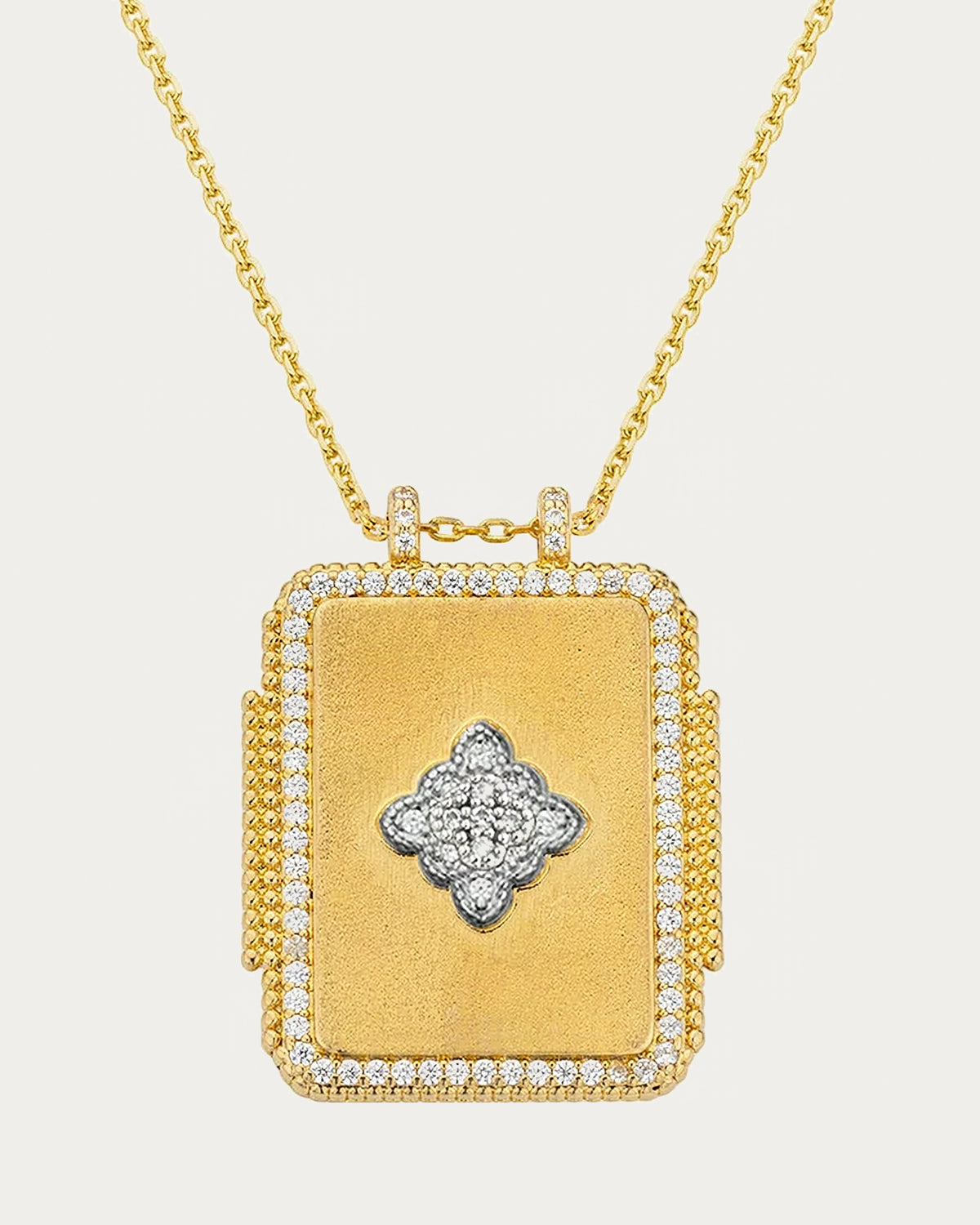 MYA—BAY Mira Boheme Necklace in gold, rectangular pendant with a clover motif and sparkling border