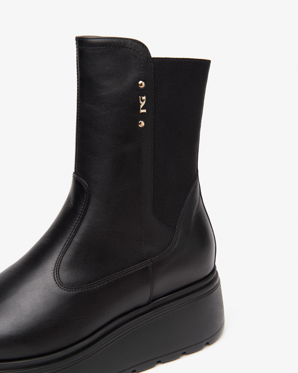 Nero Giardini Black Low Platform Ankle Boot, logo studs and stretch panel close-up
