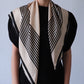 No.1 in Sand scarf by Lescarf draped over the shoulders with a black top