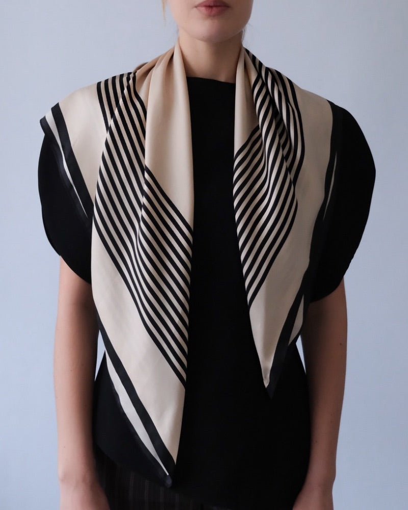 No.1 in Sand scarf by Lescarf draped over the shoulders with a black top
