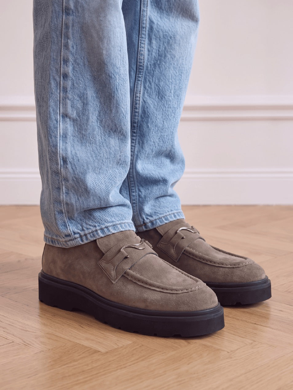 NUBIKK Ella Monroe khaki suede loafer boots worn with light blue jeans on parquet floor