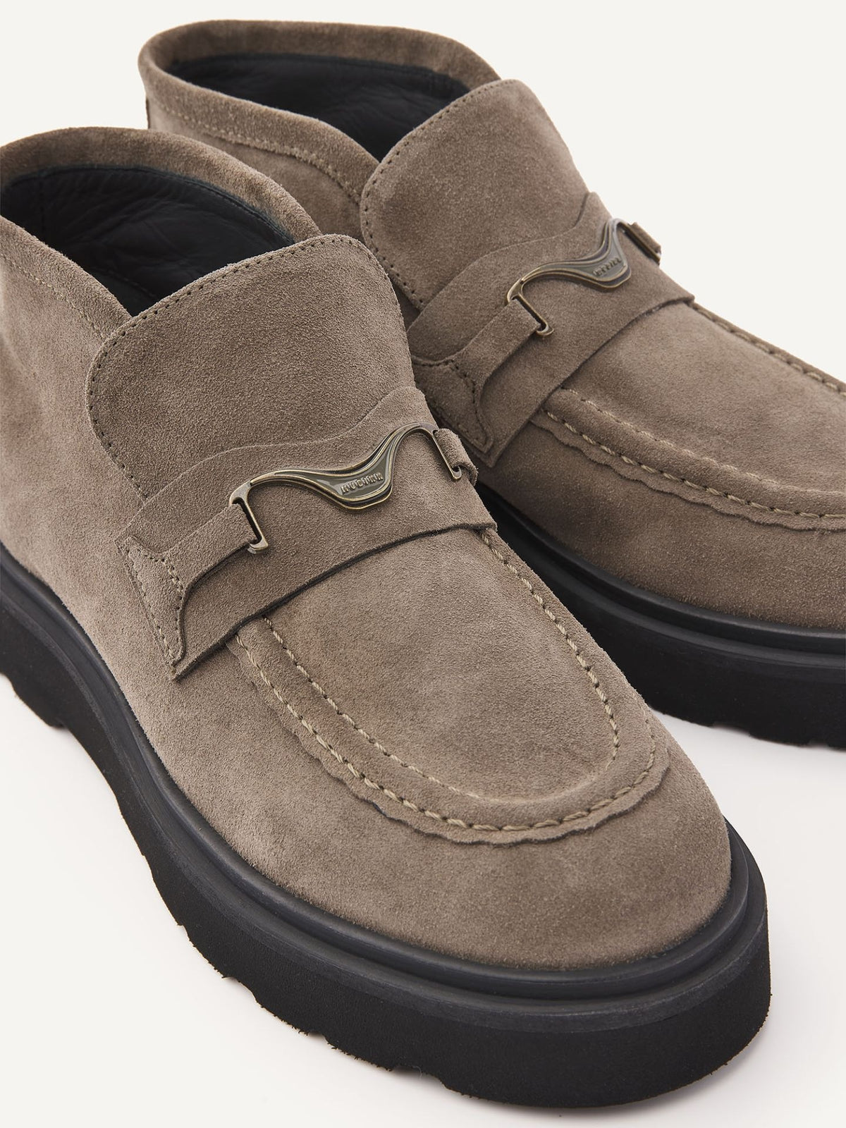 Pair of NUBIKK Ella Monroe khaki suede loafer boots, close-up of suede and front hardware