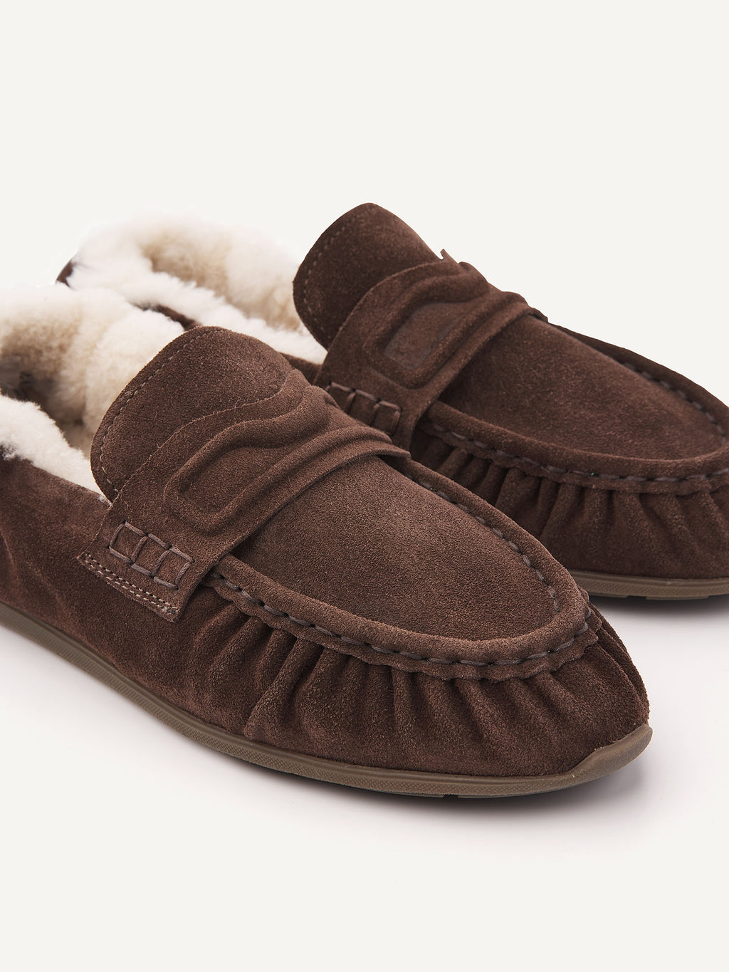 Close-up of the pleated front and penny strap on the NUBIKK Riley Mio Fur loafer