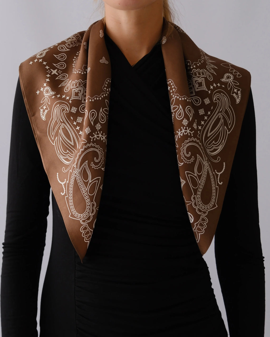 Paisley Scarf in Mocha Mousse by Lescarf worn folded over the shoulders with a black top