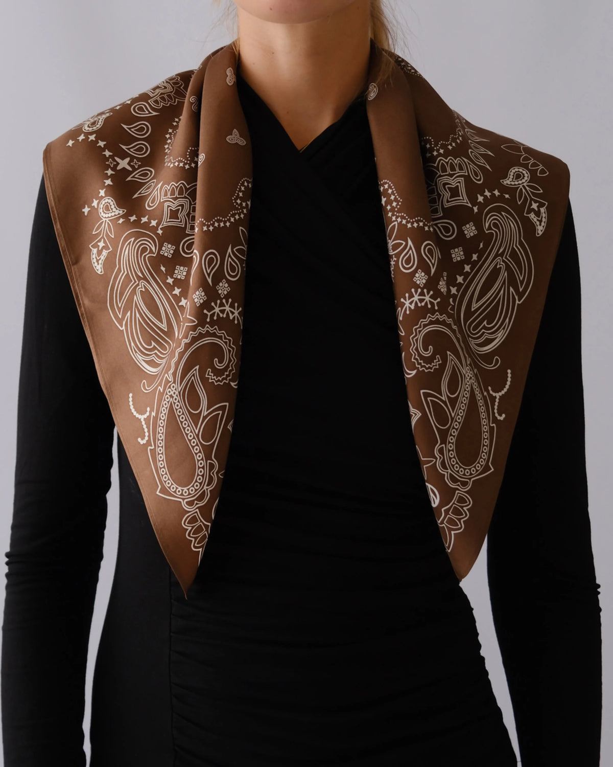 Paisley Scarf in Mocha Mousse by Lescarf worn folded over the shoulders with a black top