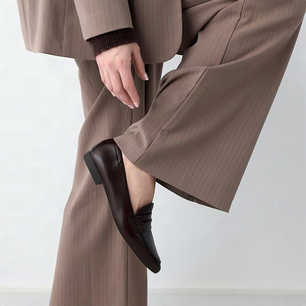 Paul Green Brown Penny Strap Ballerina Flat, worn with a tailored suit