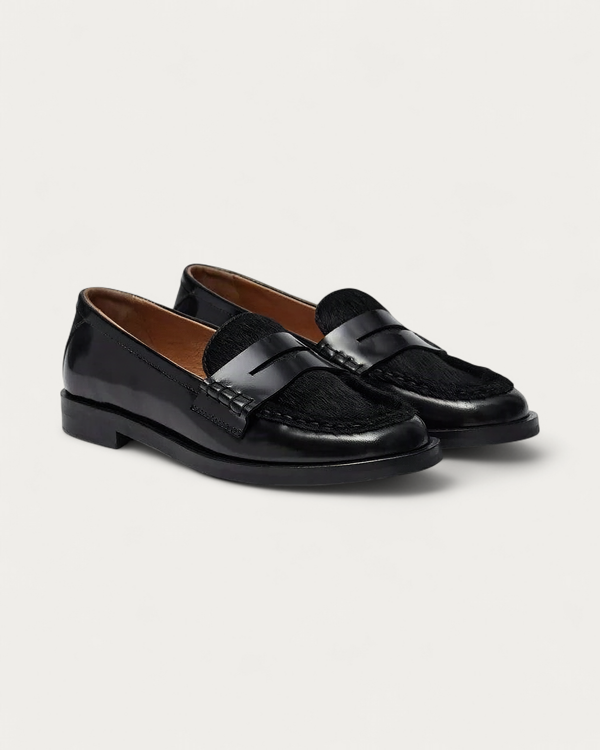 Pair of Pavement Pacassie Pony Loafers in black leather with penny strap