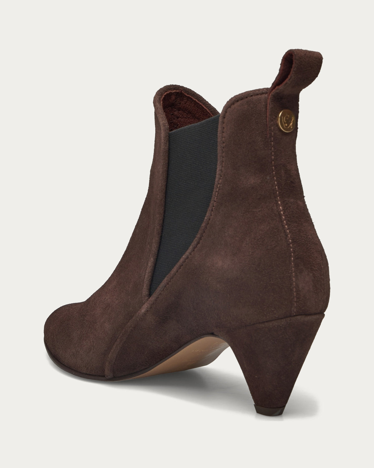 Rikley 50 brown suede ankle boot, rear three-quarter view with pull tab and gold button