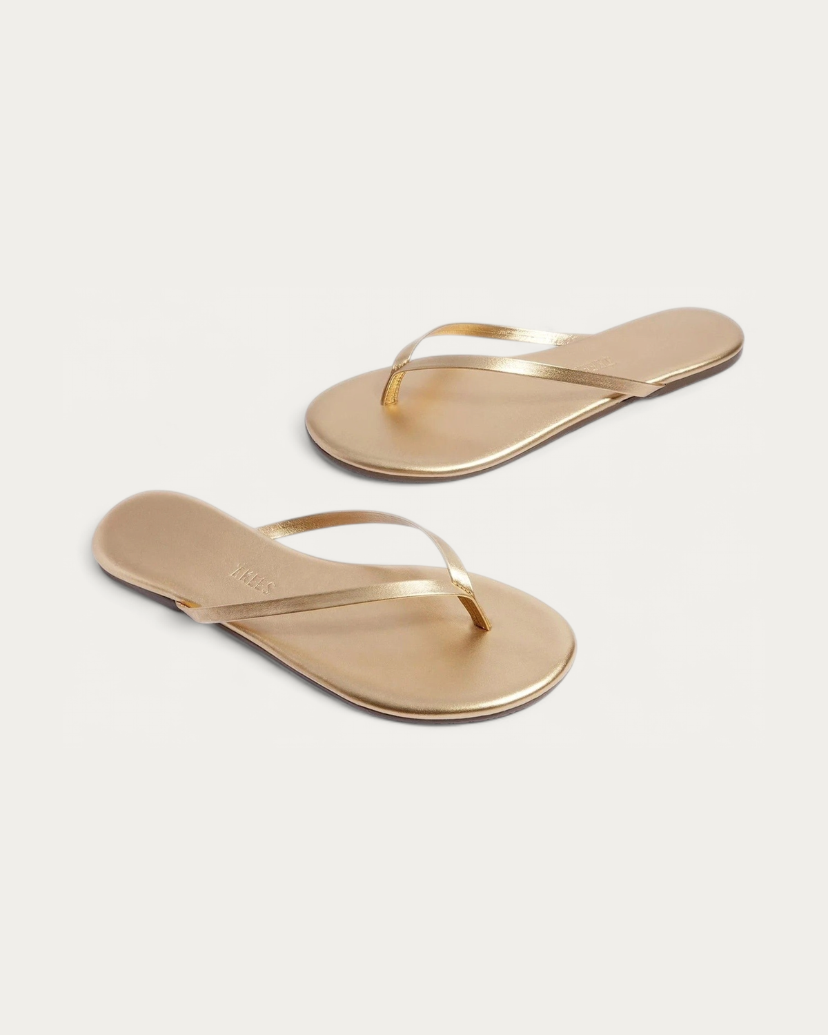 TKEES Metallics Blink Gold Leather Flip Flop, three-quarter view