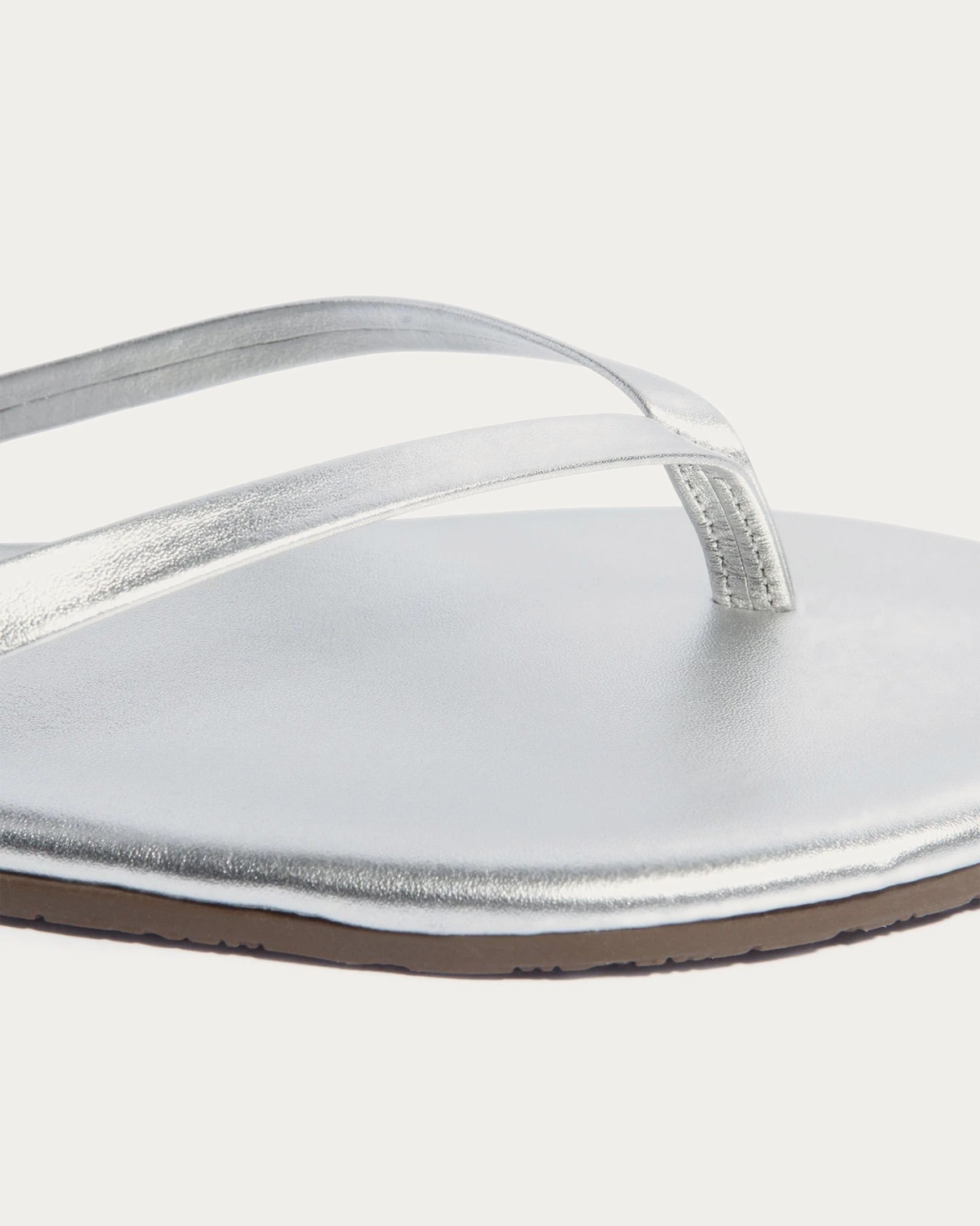 TKEES Metallics Fairylust Silver Leather Flip Flop, close-up of the straps and footbed