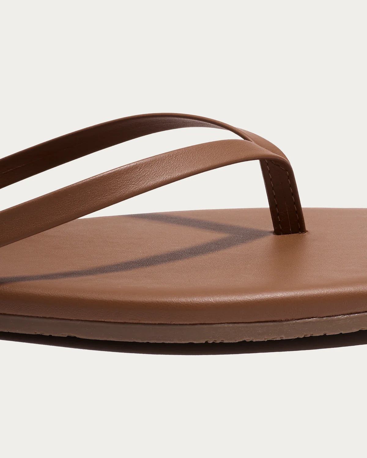 TKEES Square Toe Lily Ganache Caramel Leather Flip Flop, close-up of the straps and footbed