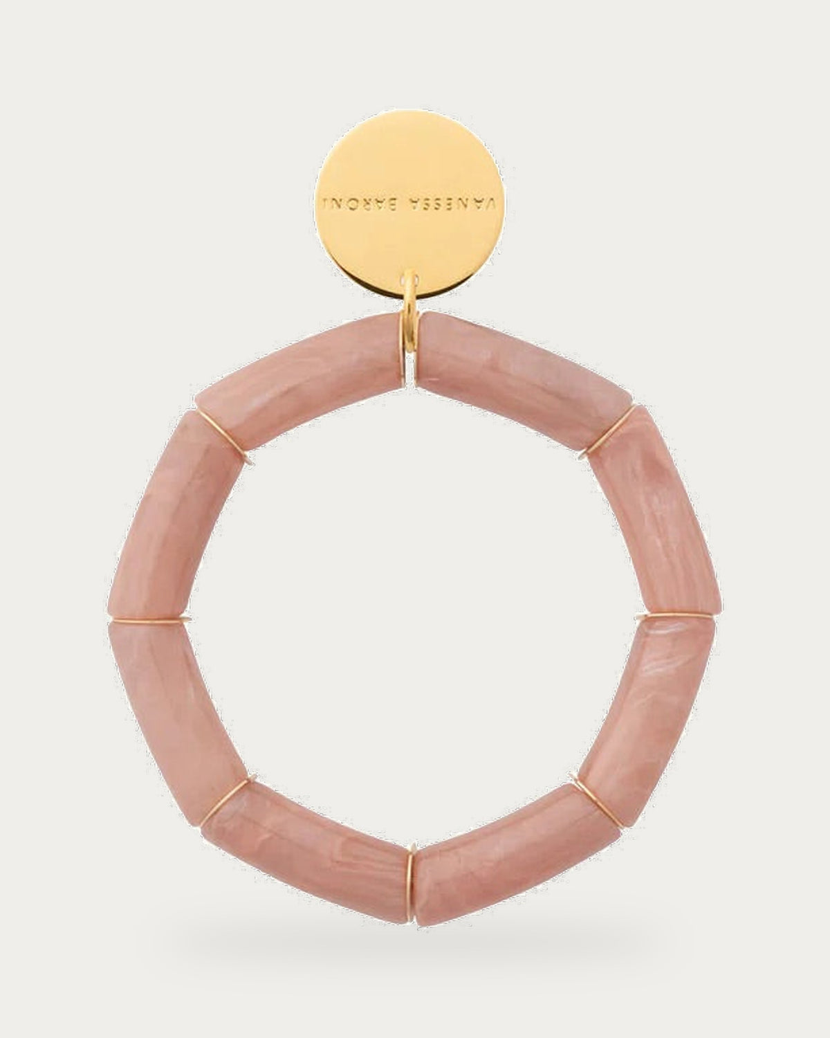 Flex Bracelet Blush Marble by Vanessa Baroni, blush marble tubular beads with gold discs and gold logo disc, front view on soft stone background
