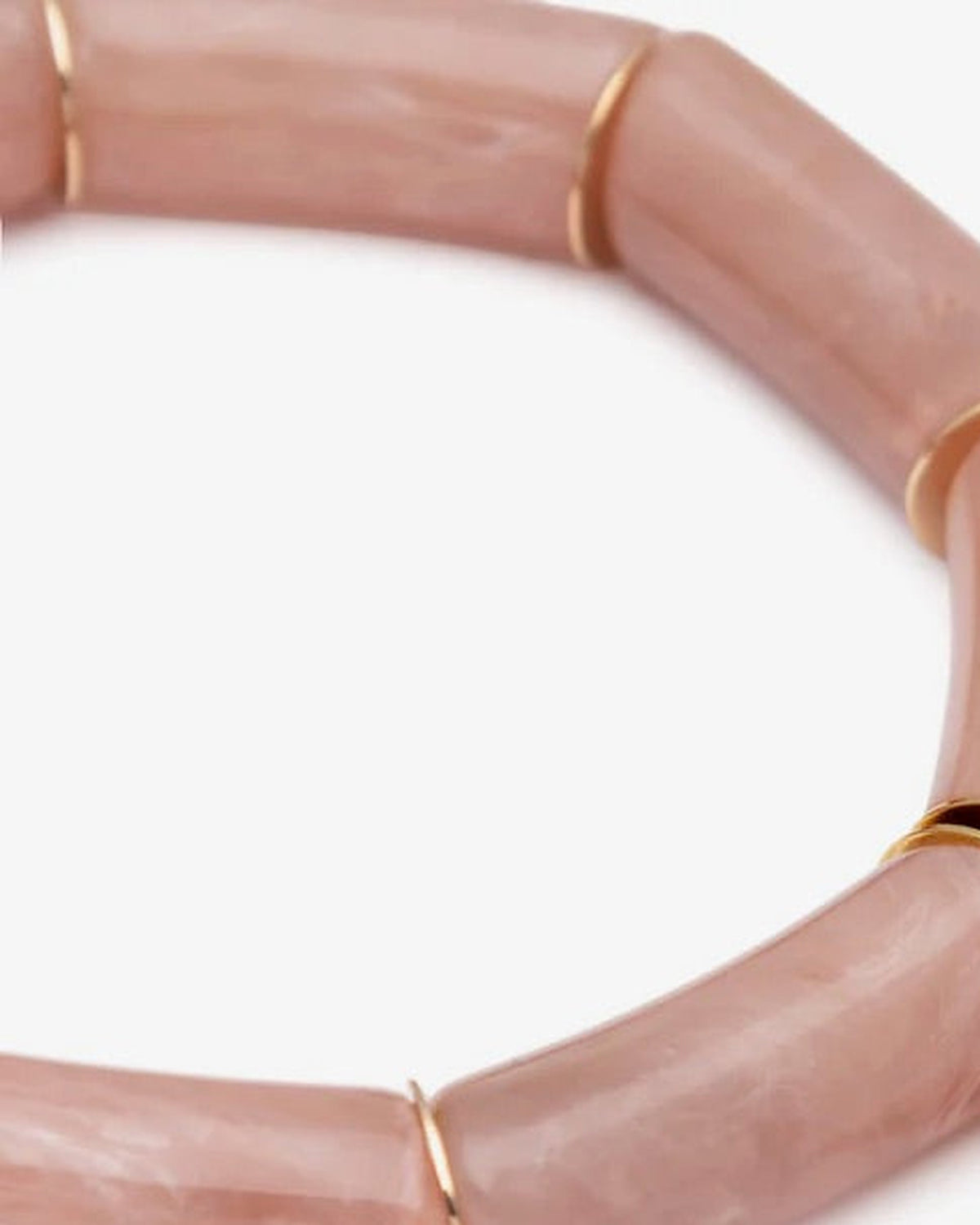 Close-up of the Flex Bracelet Blush Marble by Vanessa Baroni showing the tubular beads with gold discs