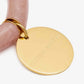 Close-up of the Flex Bracelet Blush Marble by Vanessa Baroni showing the tubular beads with gold discs and the gold logo disc