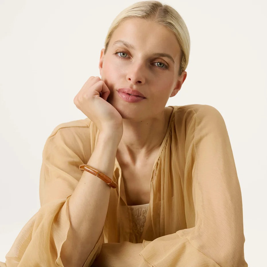 Flex Bracelet In Cognac Marble by Vanessa Baroni, worn on a model's wrist