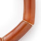 Close-up of the Flex Bracelet In Cognac Marble by Vanessa Baroni showing the tubular beads and gold discs
