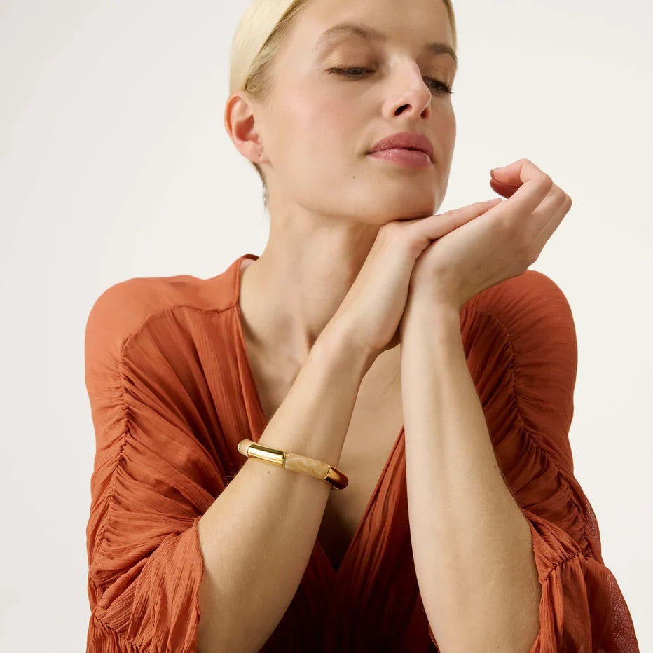 Flex Bracelet In Gold Creme Brulee by Vanessa Baroni, worn on a model's wrist