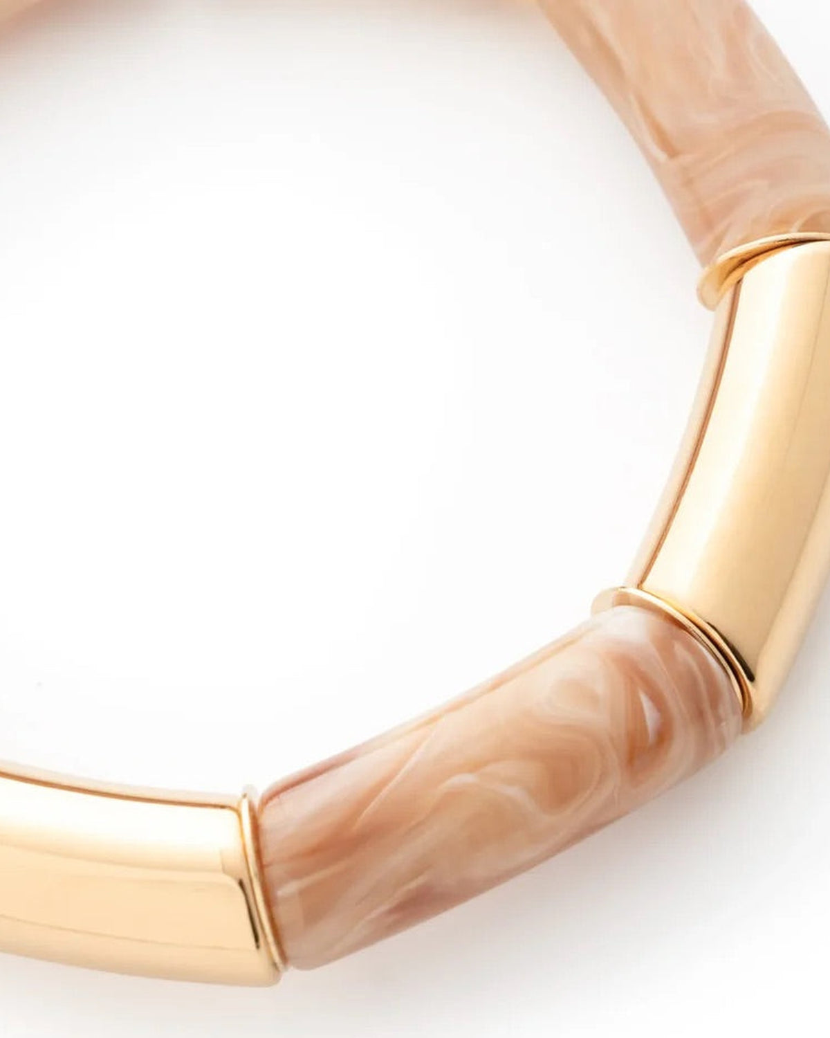 Close-up of the Flex Bracelet In Gold Creme Brulee by Vanessa Baroni showing the tubular beads and gold discs