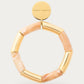 Flex Bracelet In Gold Creme Brulee by Vanessa Baroni, product photo on a soft off-white background