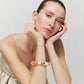 Ibiza Bracelet In Watermelon by Vanessa Baroni, worn on a model's wrist