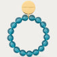 Mini Beads Flex Bracelet In Clear Teal by Vanessa Baroni, product photo on a soft off-white background