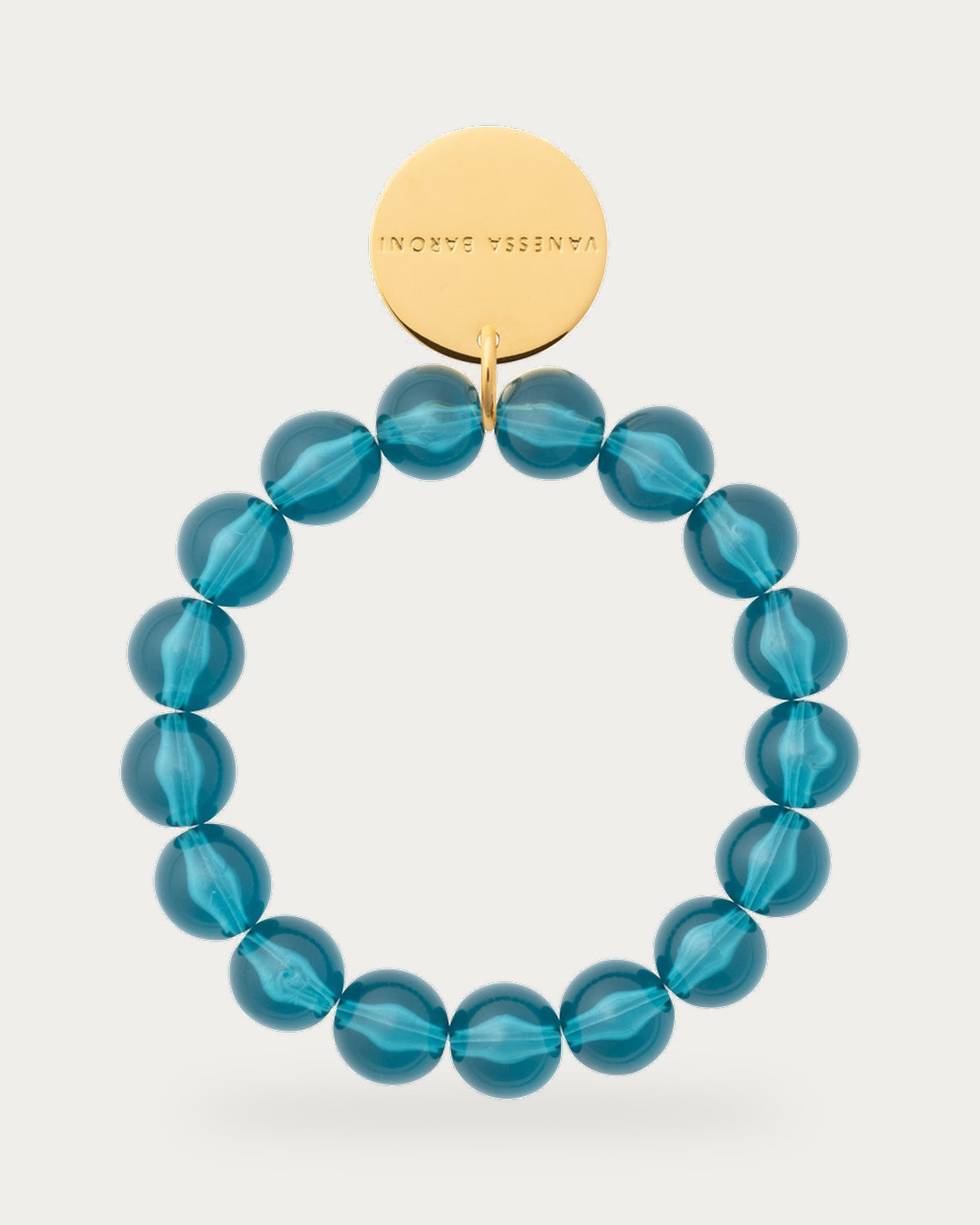 Mini Beads Flex Bracelet In Clear Teal by Vanessa Baroni, product photo on a soft off-white background