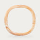 Soft Edge Bangle In Creme Brulee Marble by Vanessa Baroni, product photo on a soft off-white background