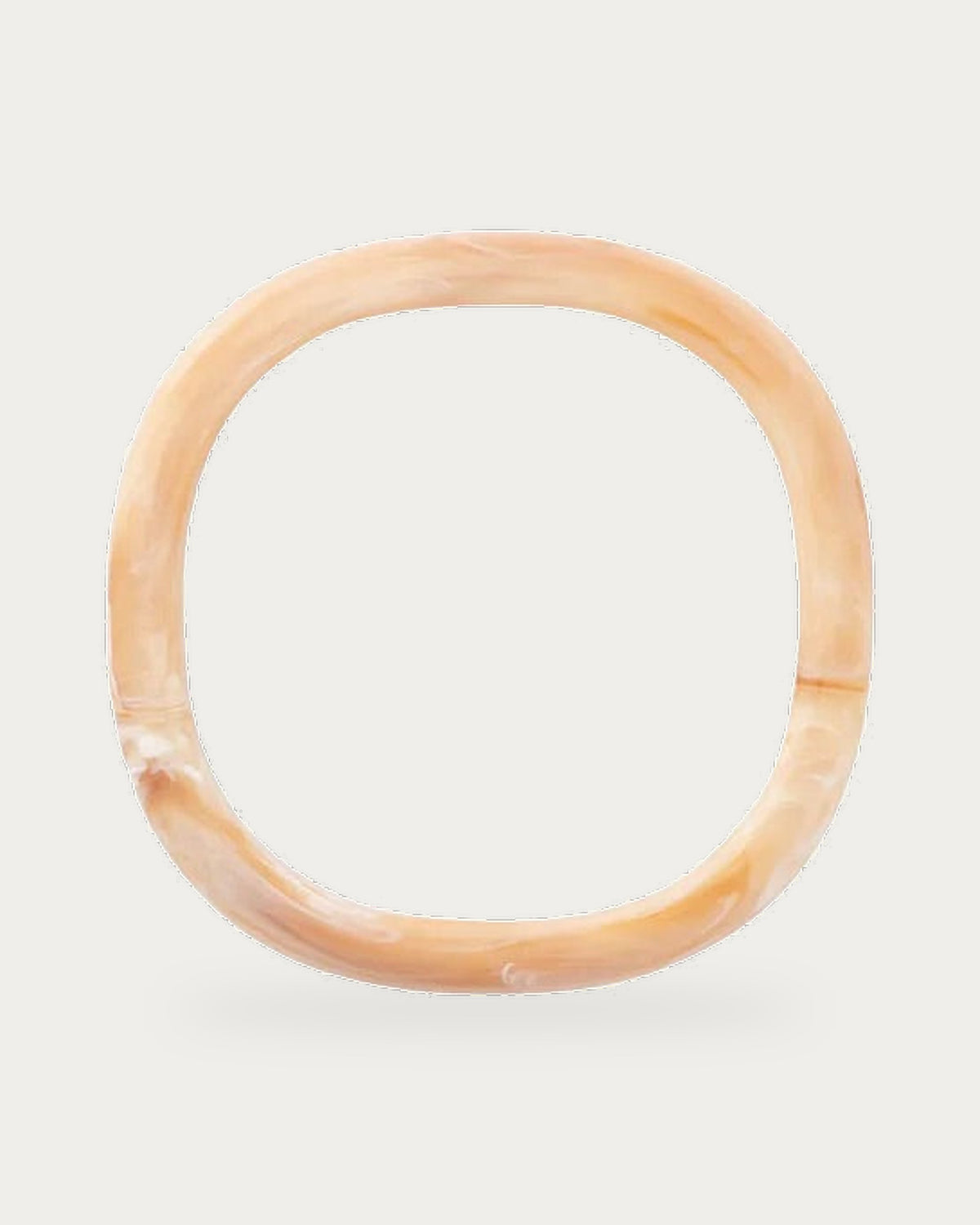Soft Edge Bangle In Creme Brulee Marble by Vanessa Baroni, product photo on a soft off-white background