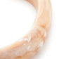 Close-up of the Soft Edge Bangle In Creme Brulee Marble by Vanessa Baroni showing the marbled finish of the bangle