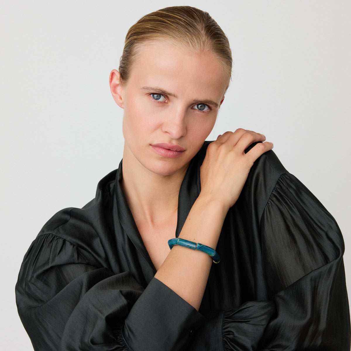 Stone Flex Bracelet In Teal Marble by Vanessa Baroni, worn on a model's wrist