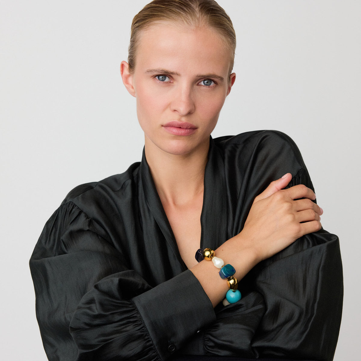 Ibiza Bracelet In Teal Marble by Vanessa Baroni, worn on a model's wrist