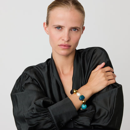Ibiza Bracelet In Teal Marble by Vanessa Baroni, worn on a model's wrist