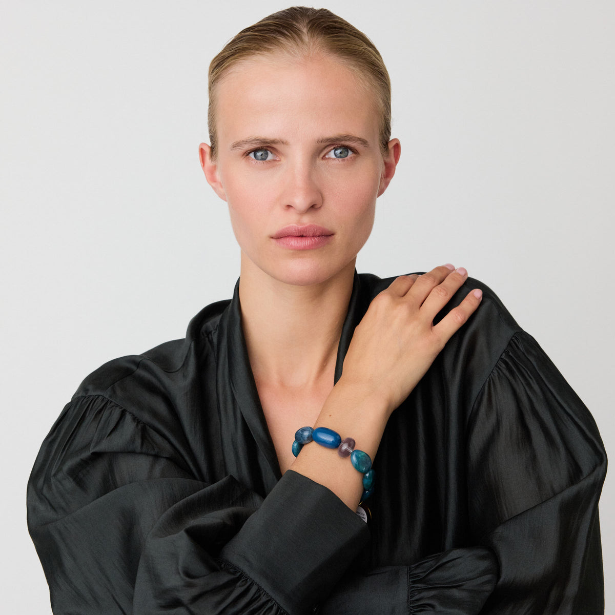 Unique Bracelet In Teal Marble by Vanessa Baroni, worn on a model's wrist