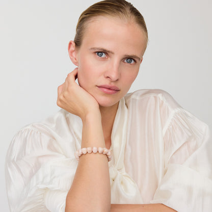 Mini Beads Flex Bracelet In Ivory Rose Marble by Vanessa Baroni, worn on a model's wrist