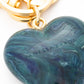 Close-up of the Heart Key Chain Charm In Teal Marble by Vanessa Baroni showing the material and finish