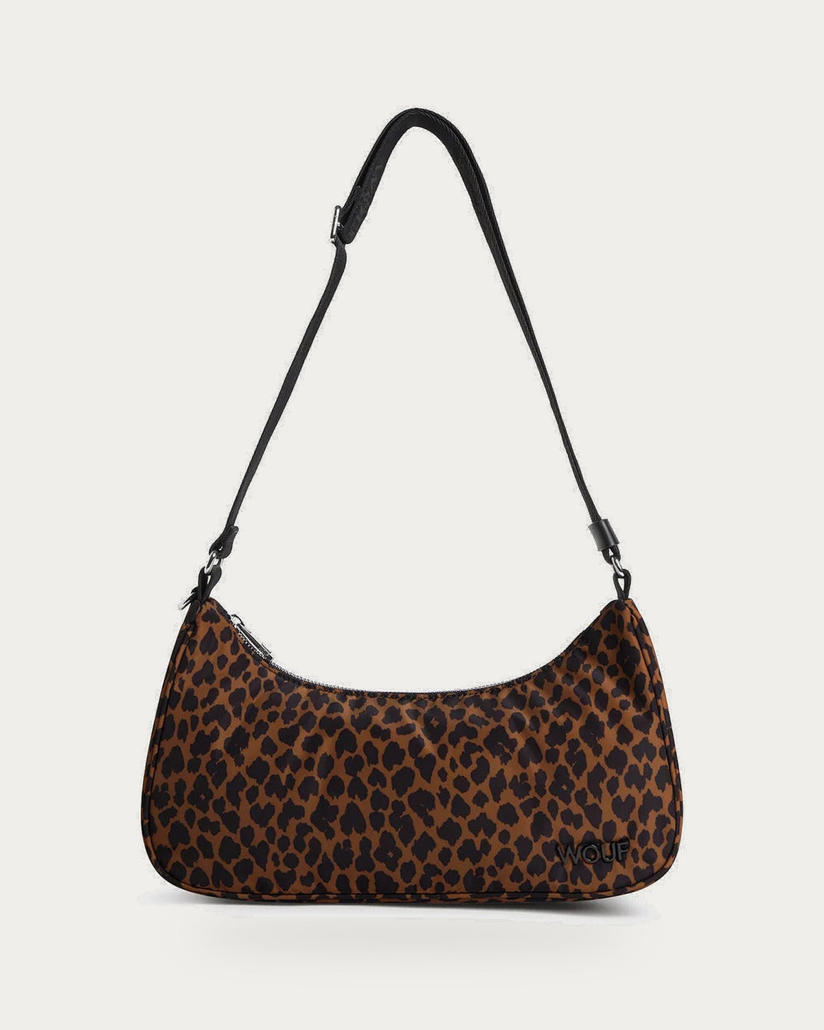 WOUF Leo Crossbody Bag in brown and black animal print with adjustable strap, front view on soft stone background