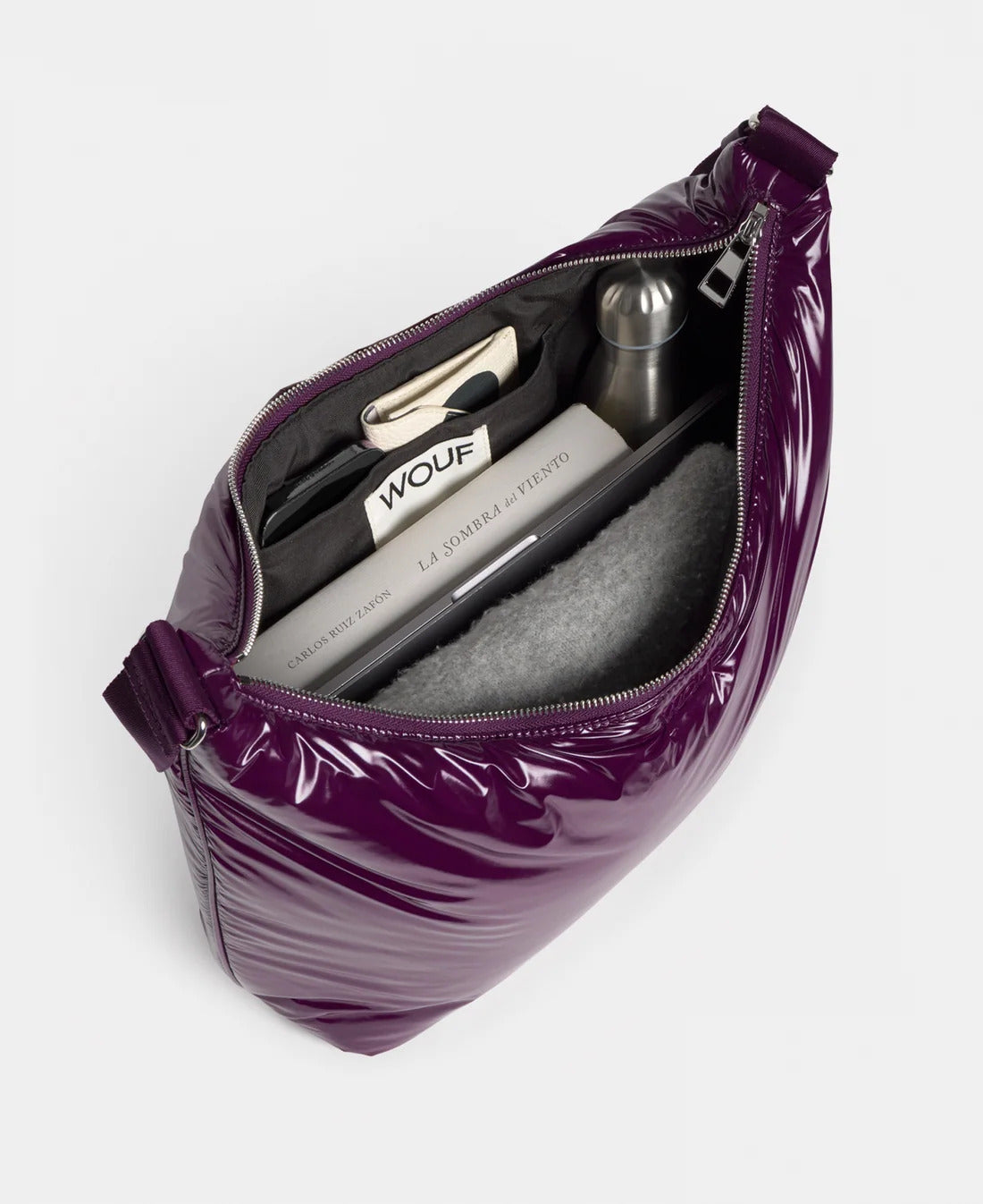 WOUF Plum Hobo Bag open from above showing the inner pocket and essentials