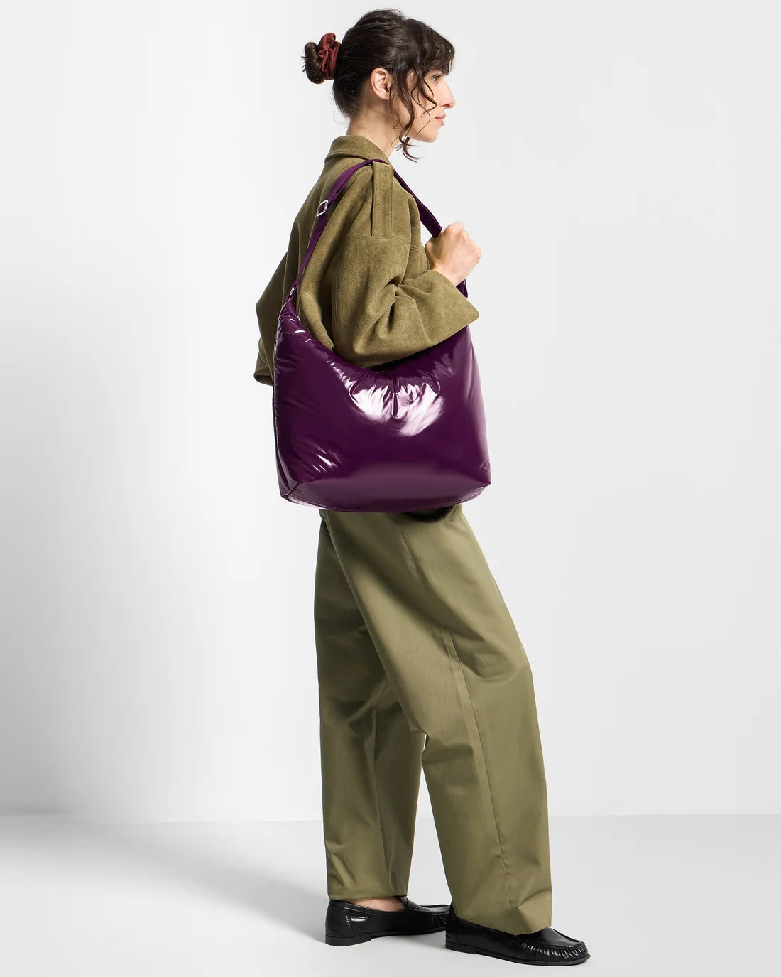 Model wearing the WOUF Plum Hobo Bag on the shoulder, side profile
